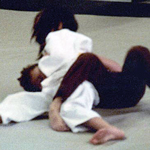 Sarah Lou Ann Wilkes - Her Kasa Katame Judo hold is broken due to the other student putting his leg around Sarah's leg.