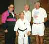 Kyoshi Sensei Edward Wilkes at the World Martial Arts Hall of Fame 1997 Seminar; from left to right back row Kyoshi Sensei Wilkes, Sensei Dan Driscoll, Sensei A. G. Longoria, front Master Dang Thong Phong (Life Achievement Award).