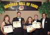 From left to right: Francis Esponoza, Renshi Gregory P. Negron, Renshi Bertha G. Wilkes, Doshu Edward E. Wilkes, and Sensei Bob Wall displaying their Certificates and Awards